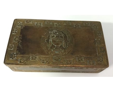 An early 19th century gilt metal rectangular snuff box, hinged cover centred by a Neo-Classical urn, Greek key borders with f