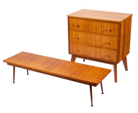 An afrormosia bedroom suite, circa 1960s; the dressing table with electric light fitment above an angled rectangular mirror; 