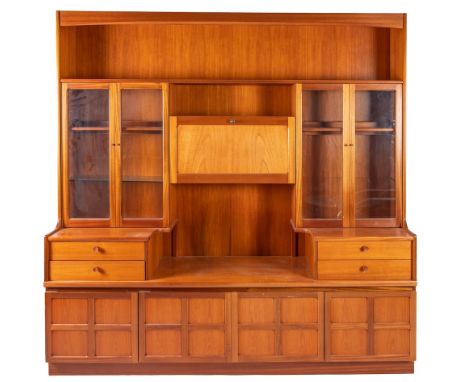 A teak lounge unit, by Nathan Furniture, circa 1970s; with open gallery above twin pairs of glass doors flanking a fall front