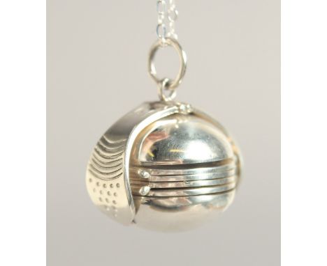 A SILVER FOLDING BALL LOCKET AND CHAIN.
