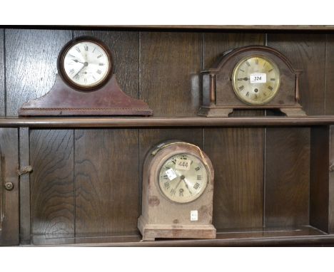 A mahogany domed mantle clock, silver dial, Roman numerals, ogee bracket feet, others (3)