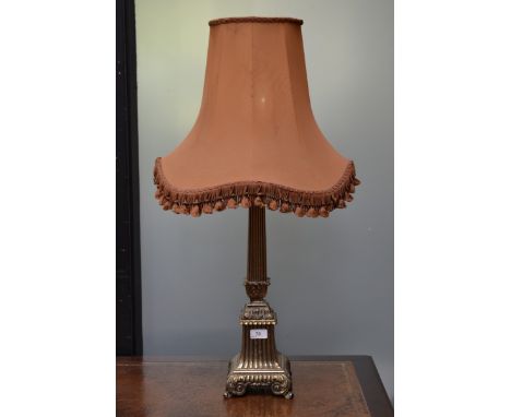A large gilt metal neoclassical table lamp