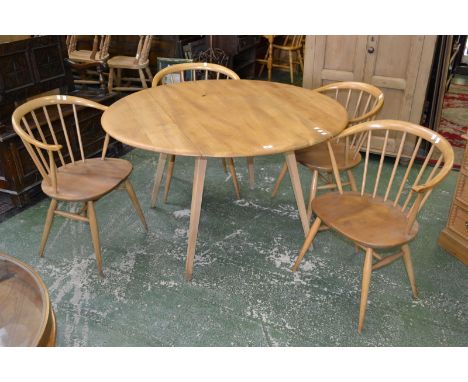 A set of four Ercol horn back dining chairs and an Ercol drop leaf table