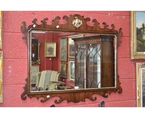 A modern vauxhall mirror, mahogany framed, golden eagle crest