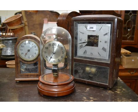 A mahogany Bulle patent electric mantle clock, a glass dome 800 day electric mantle clock, a Bulle clockette, inlaid mahogany
