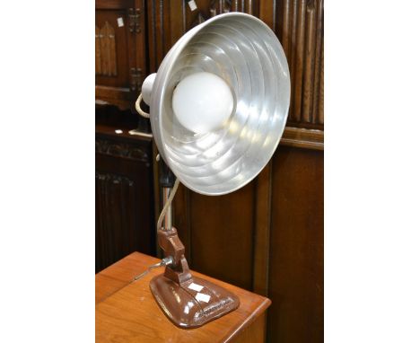A mid 20th century heater lamp converted for use as a lighting lamp.