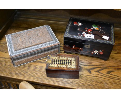 A lacquer and mother of pearl musical jewellery box, Indian carved wood inlaid box; a Tunbridge inlaid cribbage box (3)