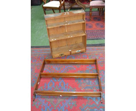 A pine shelf unit and a wall rack