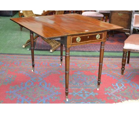 A 19th century mahogany Pembroke table, single drawer with brass roundel escutcheons and loop handles, blind drawer to verso,