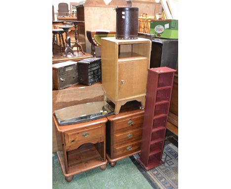 A stained pine three drawer bedside chest; a stained pine bedside cabinet; a light oak Austinsuite bedside cabinet; a 1940's 