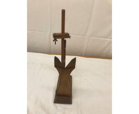 A wooden test stand for regulating mantel clocks