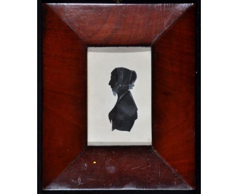 Manner of Francois Edwart - a miniature silhouette bust portrait of a lady wearing a lace cap, with inscription on a label ve