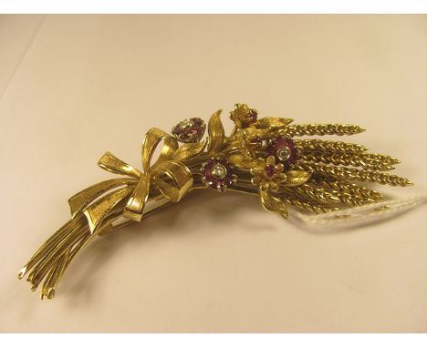 An 18ct yellow gold brooch forming wheat set with ruby and diamond clusters