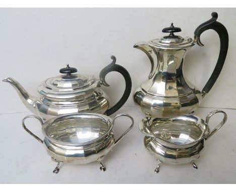 An early 20th century silver four piece tea service comprising teapot, milk, sugar and hot water jug