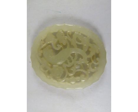 A Chinese pierced and carved jade plaque