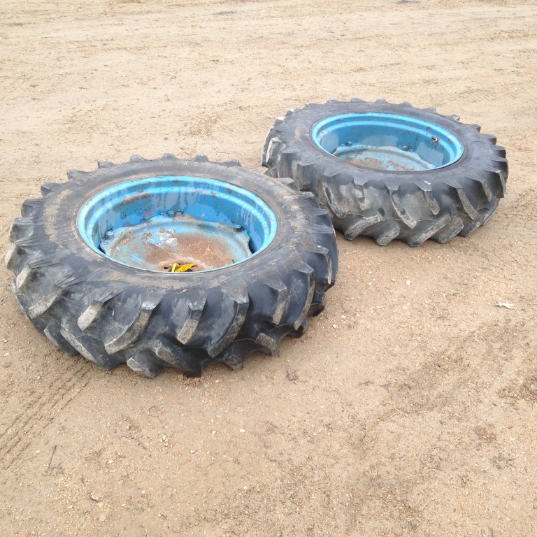 2 Tractor Tires 13.6x28 on Ford Rims and Centers