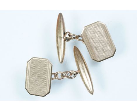 Pair of 9ct gold cufflinks having rectangular heads with engine turned details and toggle backs. Hallmarked Chester 1936. Hea