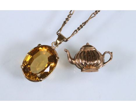 9ct gold citrine pendant necklace being set with an oval mixed cut citrine in a prong setting (pendant Sheffield 2001) on a f