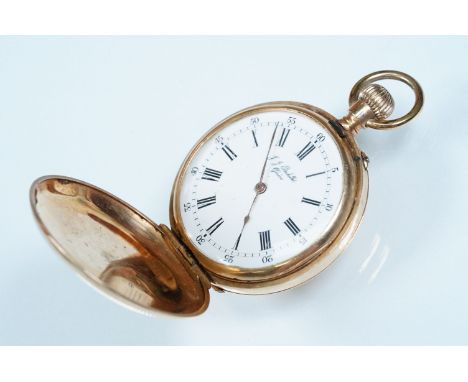 14ct gold full hunter fob watch having an engine turned case with white enamel dial, roman numerals to the chapter ring. Case