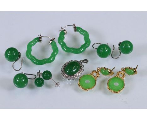Collection of jade earrings to include a pair of carved green jade hoop earrings, two pairs of jade orb earrings, a pair of s