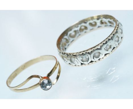 Two gold rings to include a two tone eternity ring set with white stones (hallmarked London 1965, size R.5) and a 15ct gold a