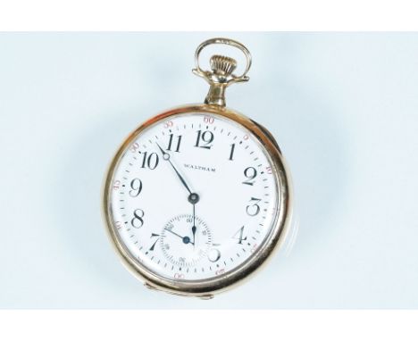 Waltham USA gold plated open face pocket watch having a white enamelled face with arabic numerals to the chapter ring and sub