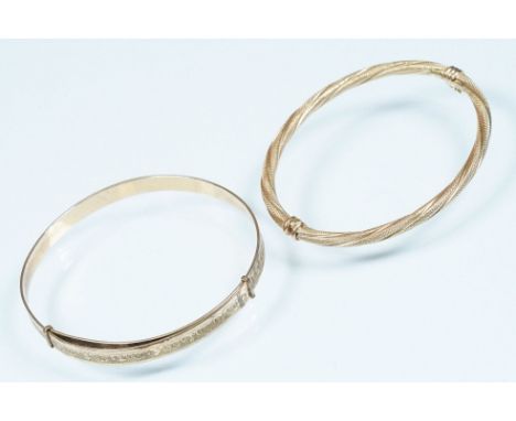9ct gold hinged bangle bracelet having twist design (hallmarked Sheffield, measures 6cm wide), together with a gold plated ex