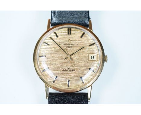 18ct gold Eterna-matic 3000 de luxe having a gilt textured dial with baton markings to the chapter ring, date aperture to thr
