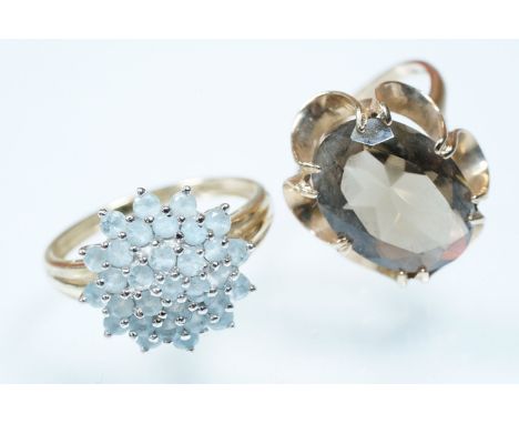 Two 9ct gold dress rings to include a smoky quartz ring with an oval cut smoky quartz set within a buttercup setting (hallmar