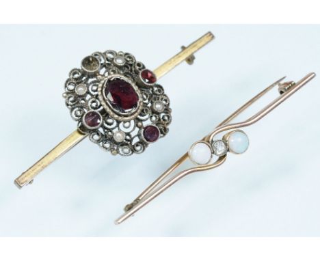 Opal and diamond bar brooch having a central round cut diamonds flanked by two oval opal cabochons bezel set in a cross over 