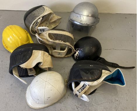 A collection of assorted theatre costume and vintage helmets. 