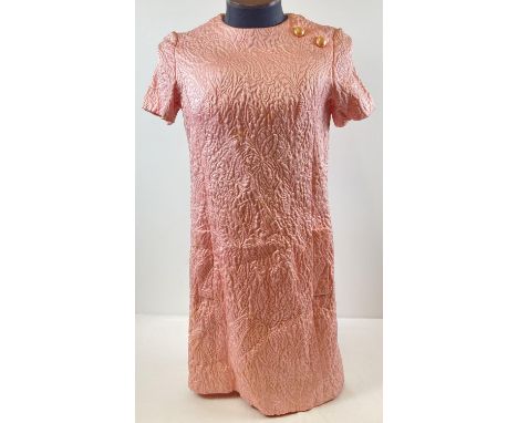 A vintage 1960's Miss Dior designer quilted floral brocade pink mini dress. Half belt detail to back with pearlised buttons t