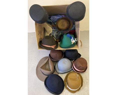 A box of assorted vintage and theatre brimmed felt hats. In varying colours and sizes. 