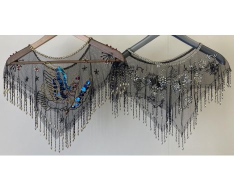2 heavily beaded black net shoulder coverings, with bead tassels to both. One with black and silver bead work in a floral des