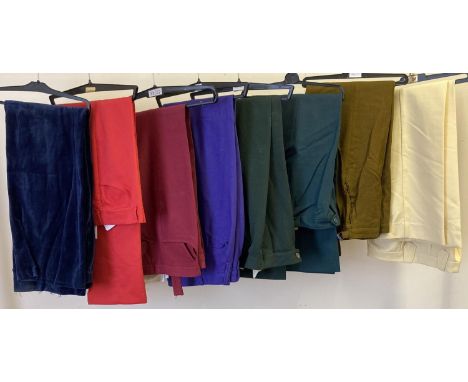 8 vintage pairs of men's brightly coloured trousers in varying materials and sizes. 