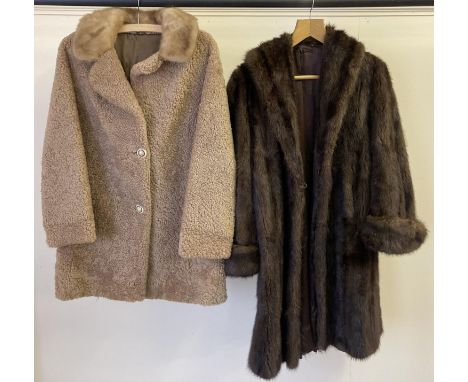 2 womens vintage coats. A dark brown swing fur coat with turn back cuffs. Together with a pale Astrakhan style coat with ligh