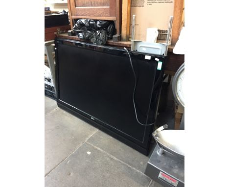 AN LG 49" HD TV WITH WALL MOUNT R