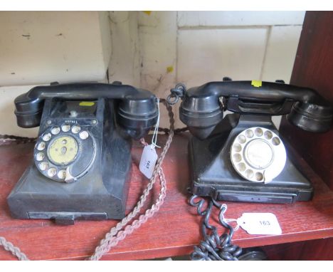 Two vintage black G.P.O. telephones, both with drawers and rotating dials (2) 