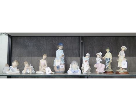 A Nao figure of a boy reading on a barrel, 26 cm high, another of an Eskimo boy lying on the floor, five other Nao figures an