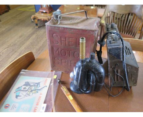 A King of the Road No. 38 car horn, a Shell oil can, a vintage car radio, an aluminium car gear knob, and a Puffin book 'Abou