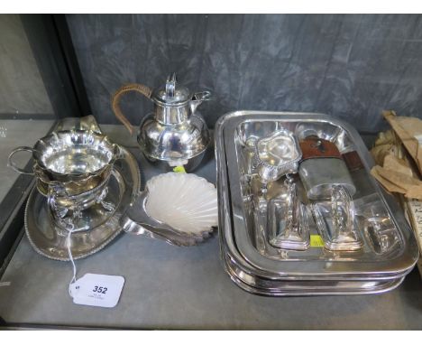 A collection of silver plate to include a pair of entrée dishes, sauce boat and tray, two shell dishes and a hip flask 