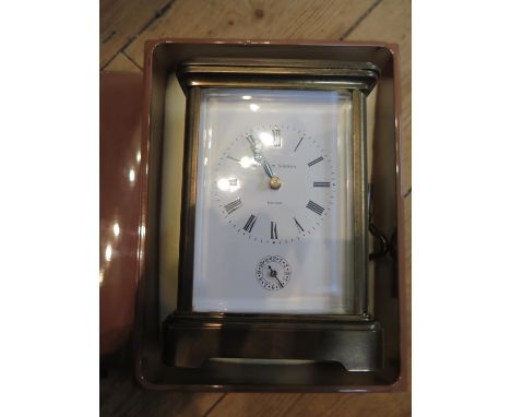 A Matthew Norman brass carriage clock, of conventional form, the enamel dial with alarm subsidiary dial, the twin train movem
