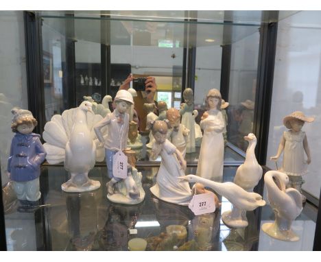 A Lladro figure of a dove, 20 cm high, two Lladro figures of geese, a Nao figure of a goose and six other Nao figures of chil