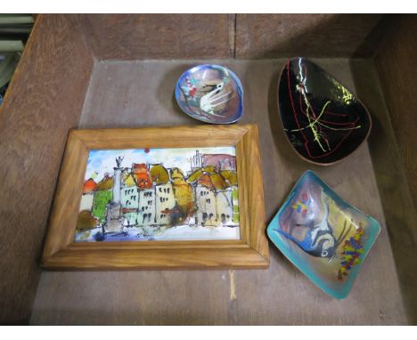 A small enamel picture of a town together with three small enamel dishes