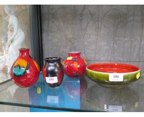 Two Volcano pattern Poole Pottery vases, another, and a Poole Pottery bowl, 18 cm diameter (4) 