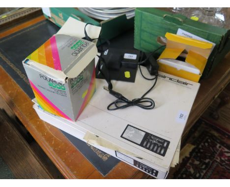 A Sinclair 'Multi-Standard Pocket Television', in original box, a Polaroid 2000 camera, Kodak instamatic camera and a Realist