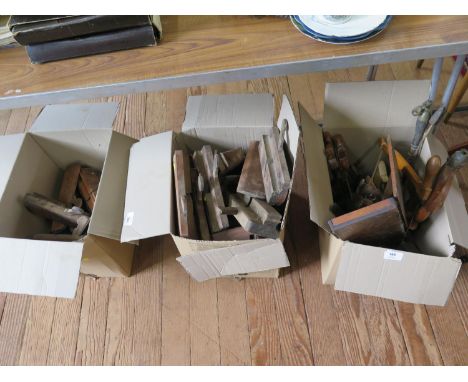 A collection of wood and moulding planes, most stamped with names, a cased micrometer, and other woodworking tools 