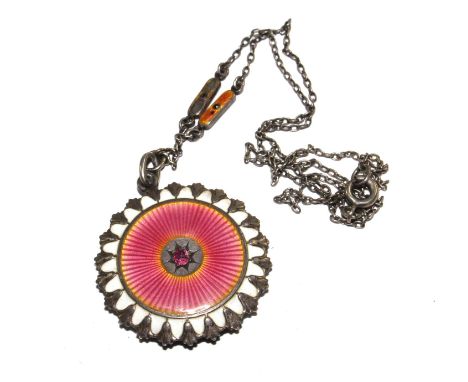 A 1920s locket and chain, the locket set with pink and white enamel with a red stone to the middle 