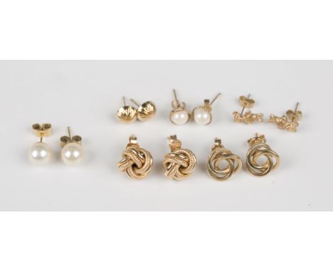 A pair of 9ct gold earstuds in an interwoven design, with post and butterfly fittings, the butterflies detailed '9ct', length