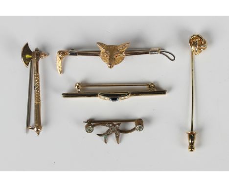 A late Victorian 9ct gold brooch, designed as an axe, Birmingham 1889, width 4.6cm, and another gold brooch, designed as a fo